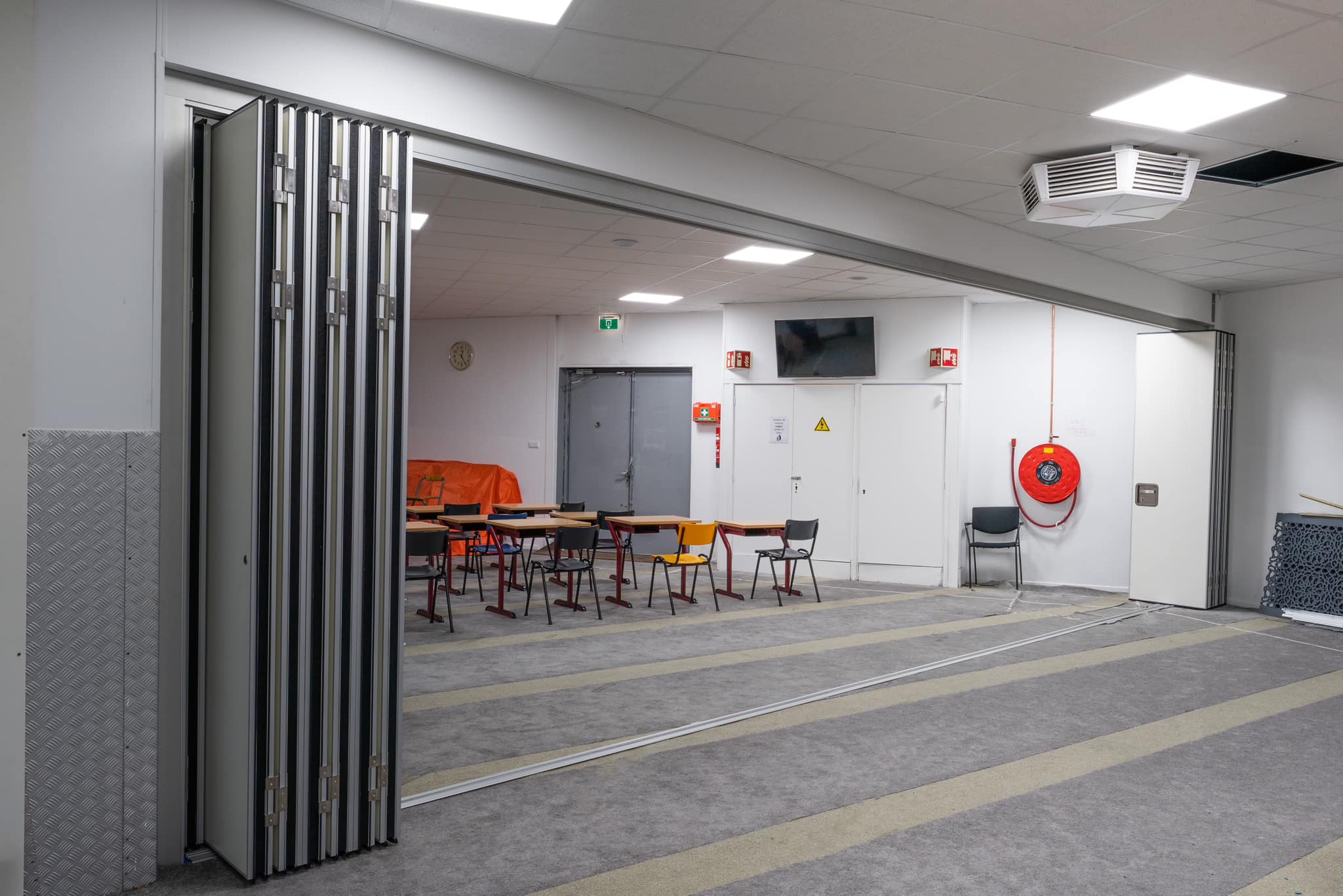 Sliding folding wall installation in Central London workspace